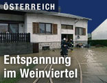 Überflutete Straße vor Haus