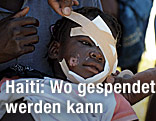 Haitianisches Kind mit Kopfverband