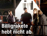 Menschen vor Rakete