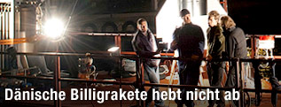 Menschen vor Rakete