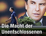 W&auml;hler vor Plakat