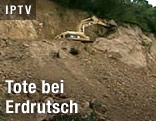 Bagger auf Schlammlawine
