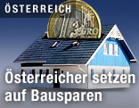 Haus mit einem M&uuml;nzschlitz im Dach und einer darin steckenden Euro-M&uuml;nze