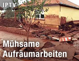 Von Giftschlamm verschmutzte Hausfassade