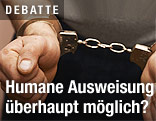 H&auml;nde in Handschellen