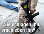 Soldat hält eine Waffe in der Hand