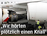 Techniker bei explodiertem Triebwerk