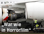 Techniker bei explodiertem Triebwerk