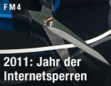 Schere zerschneidet Kabel.
