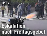 Polizist schießt bei einer Demonstration in Kairo