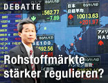 Mann vor Börsenkursen