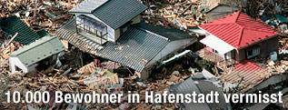 Zerstörte Häuser in japanischer Hafenstadt Minamisanriku