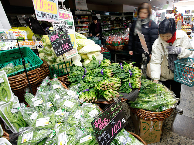 © Reuters/Aly Song Frau auf Gemüsemarkt
