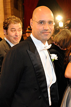 © APA/Roland Schlager Saif Gaddafi und Mustafa Zarti (links) auf dem Opernball im Februar 2010
