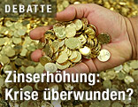 Eine Hand voller Euro-M&uuml;nzen