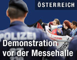 Demonstranten und Polizist
