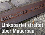 Reste der Berliner Mauer im Boden