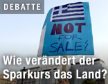 Transparent bei Demonstration gegen Sparmaßnahmen