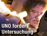 brennendes Plakat von Muammar Gaddafi