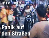 Menschen in Panik auf der Straße