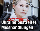 Eine Timoschenko-Sympathisantin h&auml;lt ein Bild der inhaftierten Politikerin in der Hand