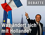 Hollande schwingt eine französische Flagge
