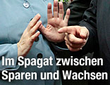 H&auml;nde von Angela Merkel und Francois Hollande