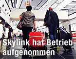 Passagiere am Weg zum Check-In