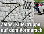 Auf einer Wand steht "Z 100 %" geschrieben