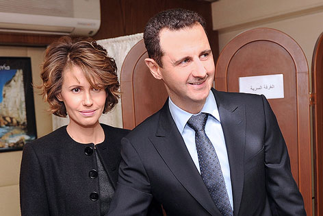 © APA/EPA/SANA/Handout Syrischer Machthaber Baschar al-Assad mit seiner Frau