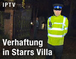 Polizist vor der Villa von Komiker Freddie Starr