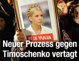 Demonstrant mit Bild von Julia Timoschenko