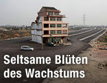 Haus auf Schnellstraße in China
