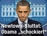 US-Präsident Barack Obama hält während seiner Rede zur Buttat an einer Schule in Connecticut bedrückt inne