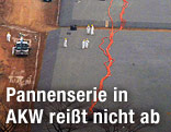 Arbeiter bei einem Auffangbecken in Fukushima