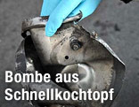 Reste eines Druckkochtopf-Deckels