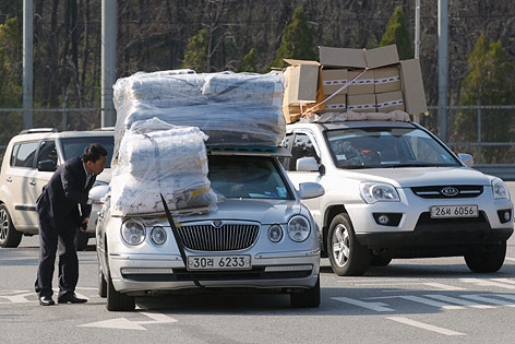 © Reuters/Lee Jae Won Vollgepackte Autos