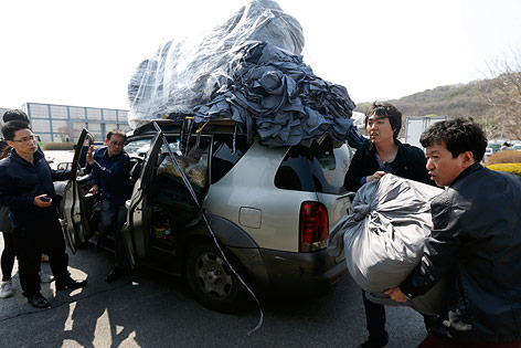 © Reuters/Lee Jae Won Vollgepackte Autos