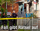 Polizeiabsperrung vor Haus