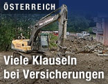 Bagger bei Aufräumarbeiten