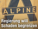"Alpine"-Logo auf Bauzaun