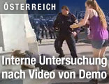 Polizist und Demonstrantin
