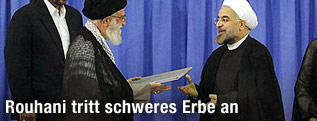 Neuer iranischer Präsident Hassan Rouhani und geistliches Oberhaupt Ajatollah Ali Chamenei