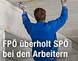 Bauarbeiter mit blauem Arbeitsgewand