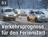 Autos im dichten Schneefall
