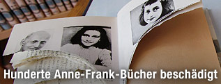 Zerst&ouml;rtes Buch mit Foto von Anne Frank