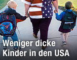 &Uuml;bergewichtige Mutter mit ihren schlanken Kindern