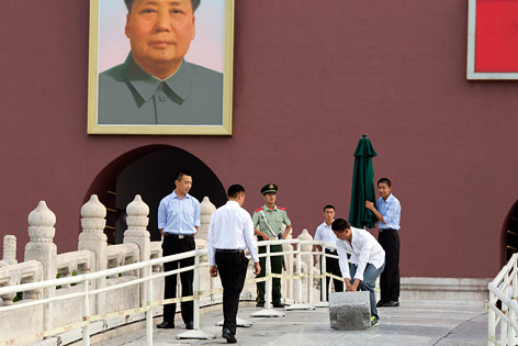© AP/Ng Han Guan Sicherheitskräfte am Tiananmenplatz