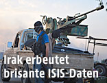 ISIS-Kämpfer vor einem Auto