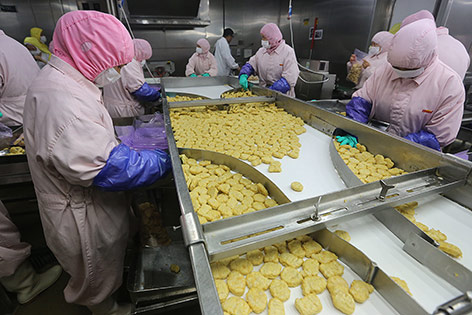 Arbeiter in der Husi Food factory in Shanghai